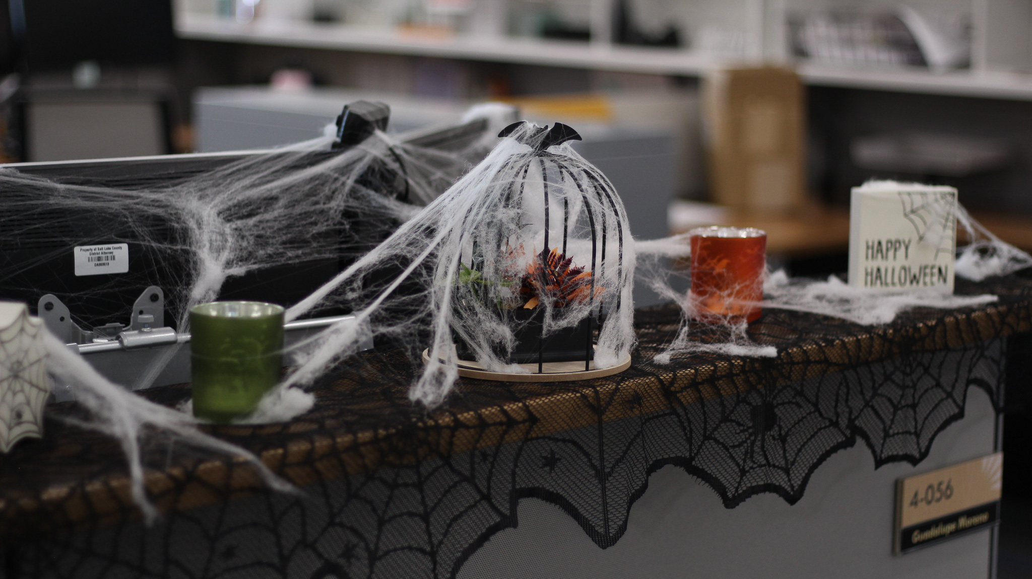 A glass of liquid and a bag of ice on a table.