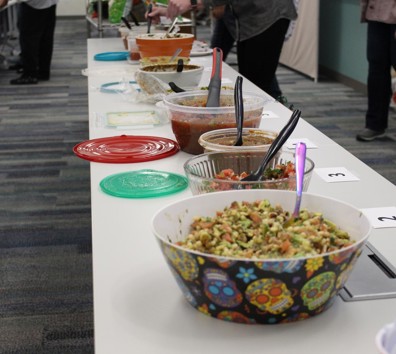 A table with bowls of food.