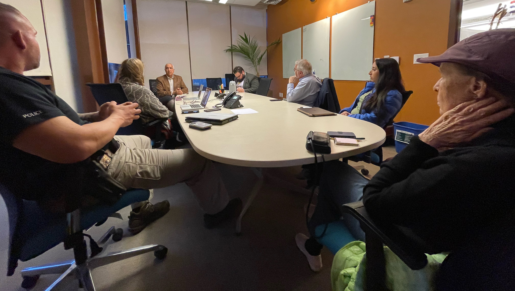 A group of people sitting around a table.