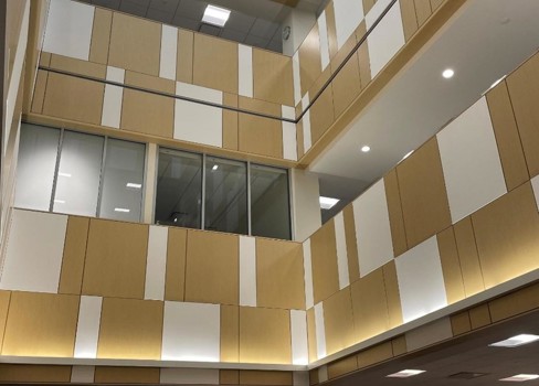 A room with a large ceiling and many windows.