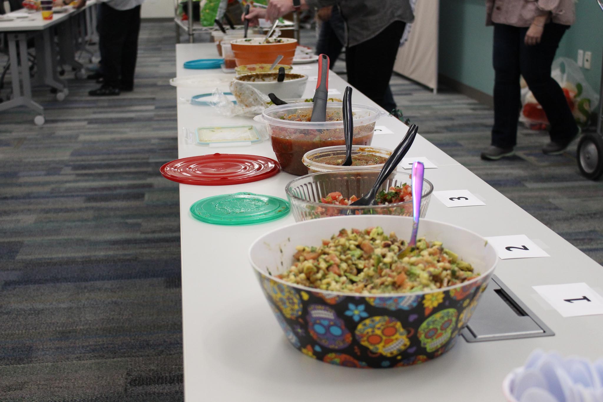 A table with bowls of food.