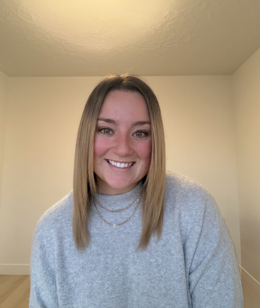 A woman smiling for the camera.