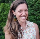 A woman smiling for the camera.