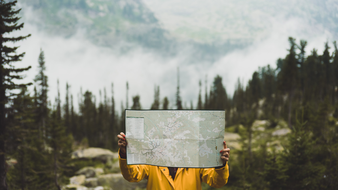 A person holding a map.