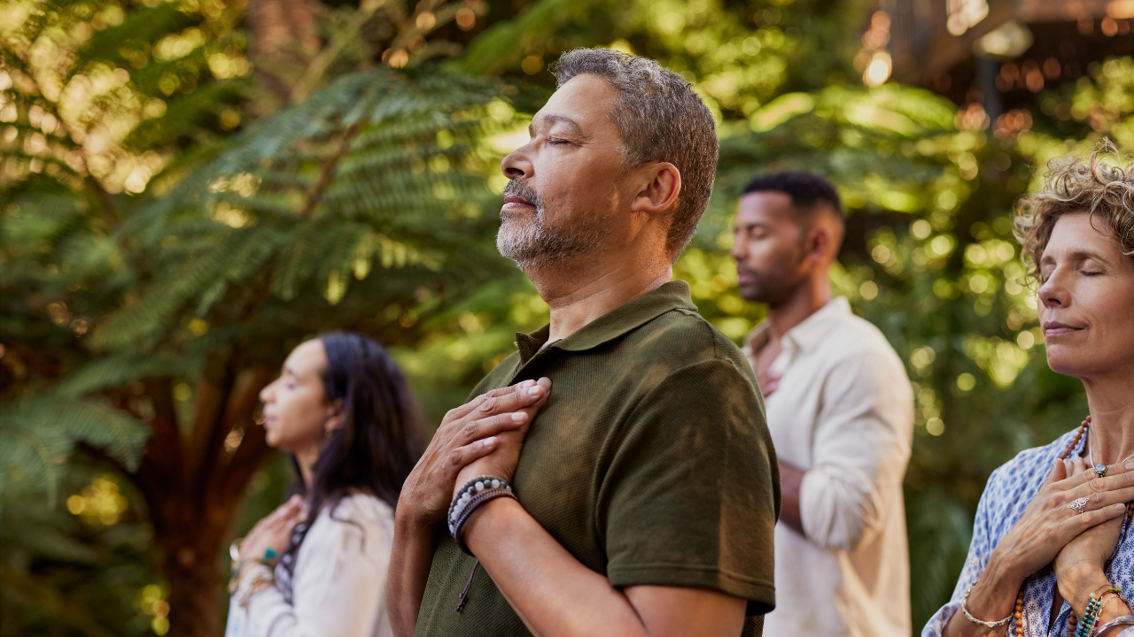 A man with his hands together.