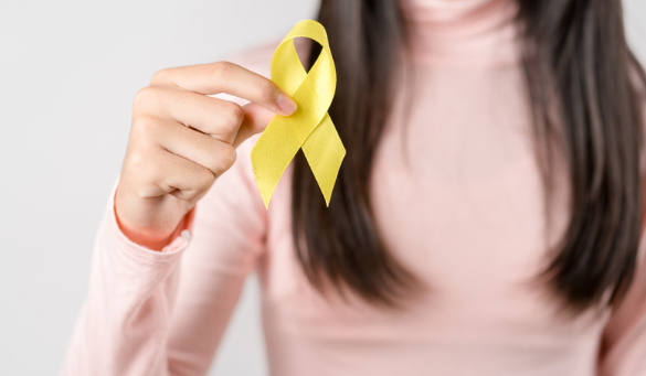 A woman holding a yellow banana.