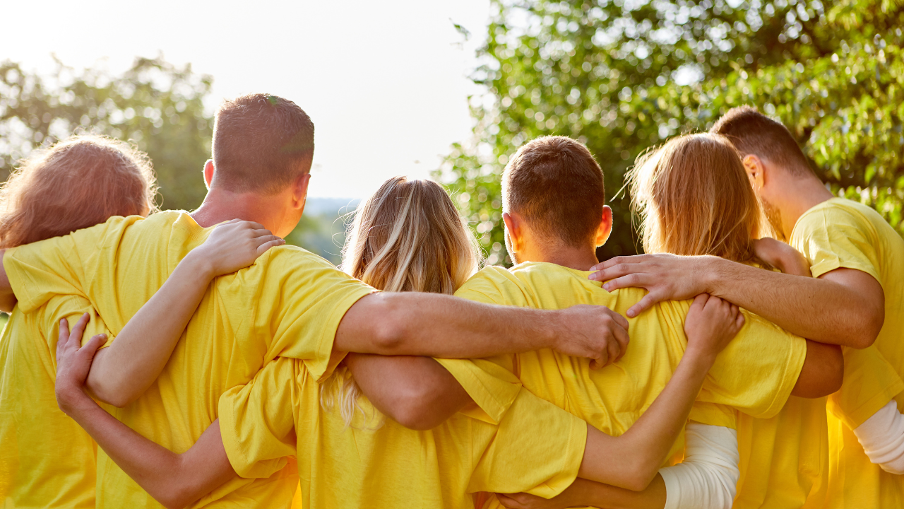 A group of people in yellow shirts.