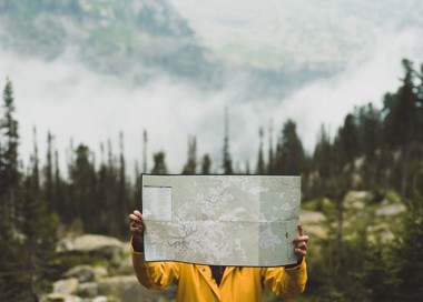 A person holding a map.