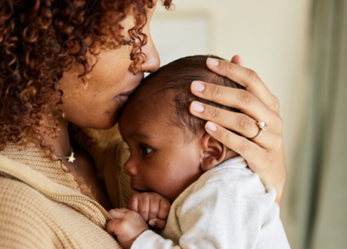 A man holding a baby.