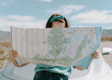 A person holding a map.
