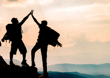A group of people climbing a mountain.