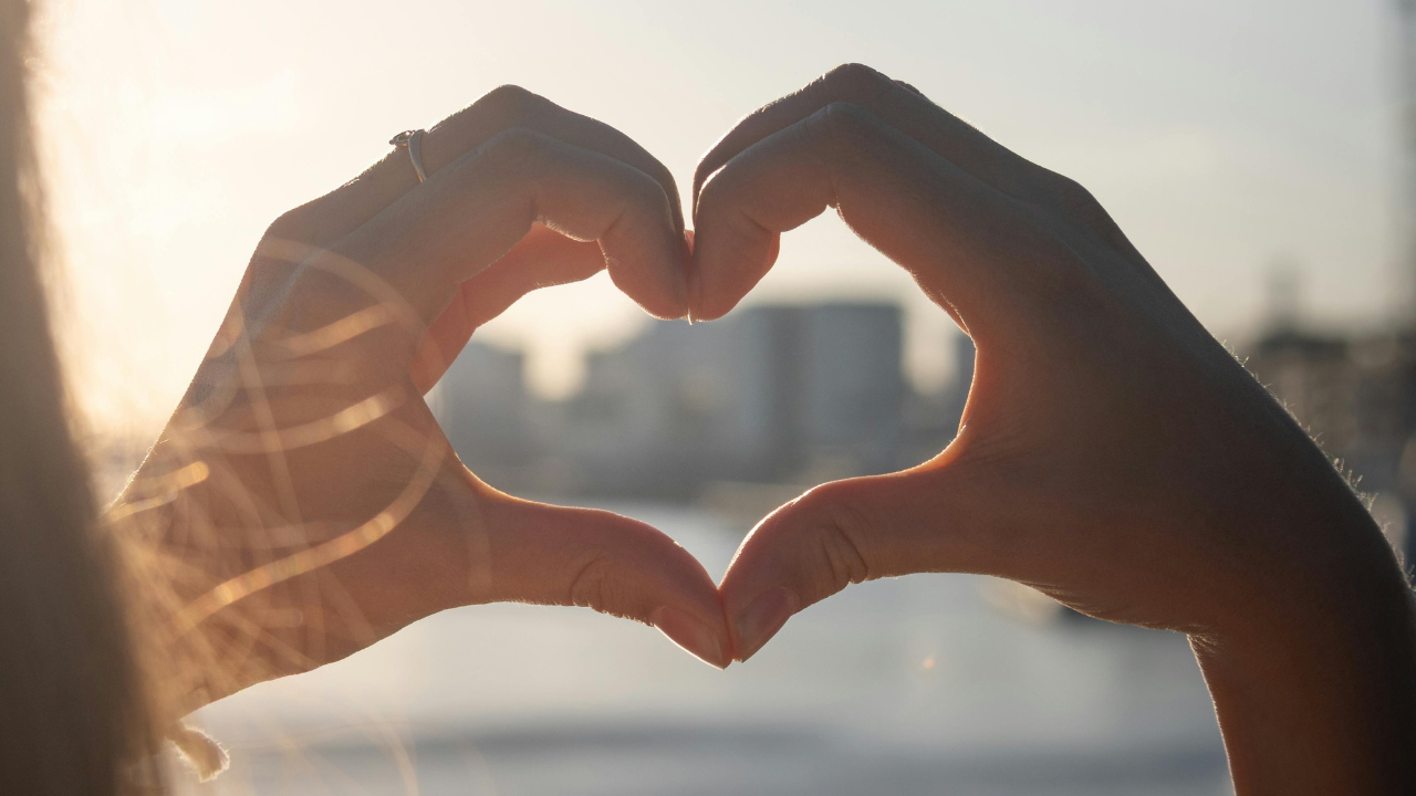 A close-up of hands shaking.