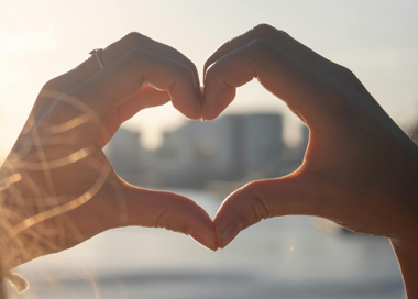 A close-up of hands shaking.