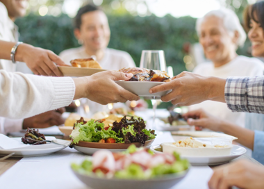 A group of people eating food.