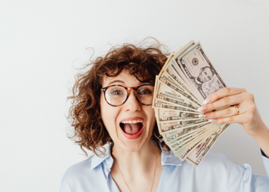 A person holding money.