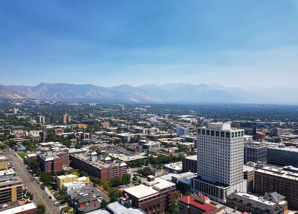 A city with a mountain in the background.