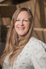 A woman smiling at the camera.