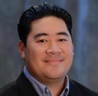 Jake Fitisemanu Jr smiling for the camera.