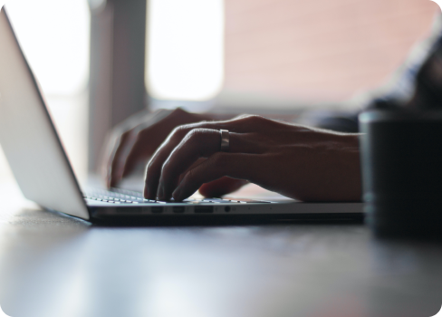 A person typing on a laptop.