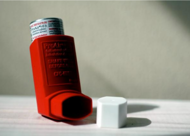 A bottle of red liquid.