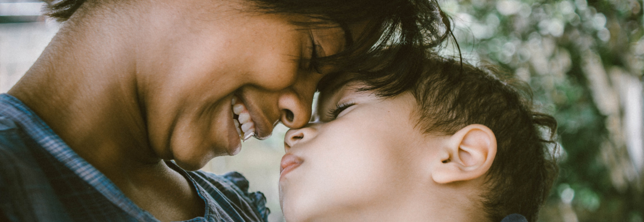 A man and a woman kissing.