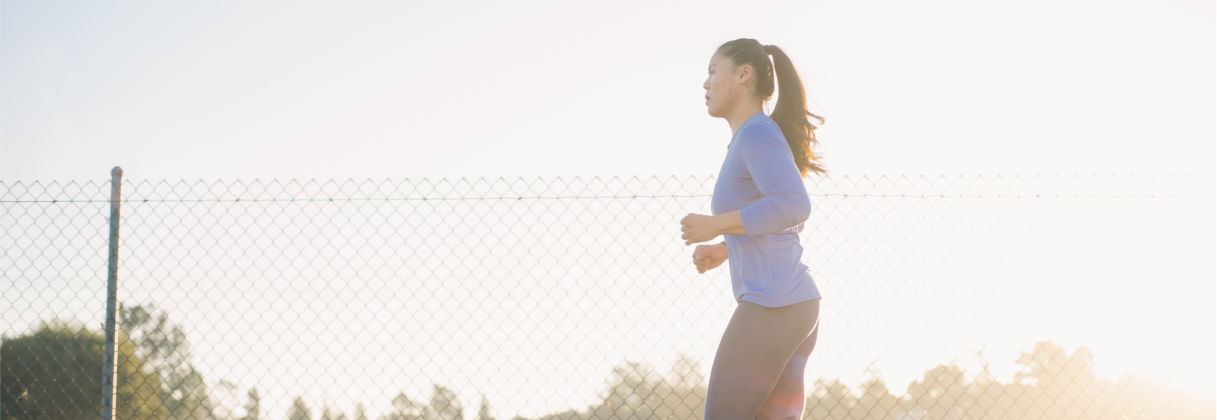 A woman running on a track.