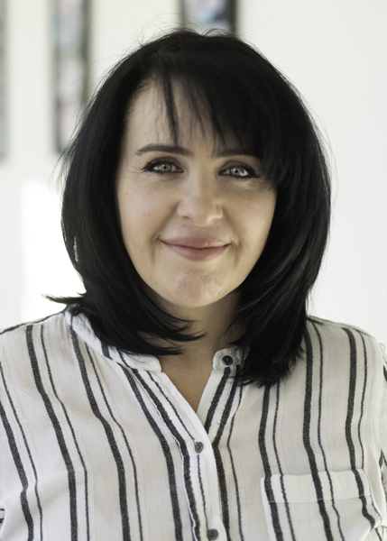 A woman with dark hair.