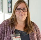 A woman wearing glasses.