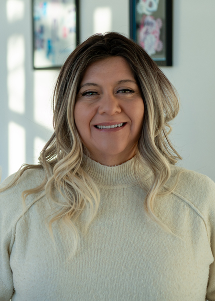 A woman smiling for the camera.