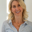 A woman smiling for the camera.