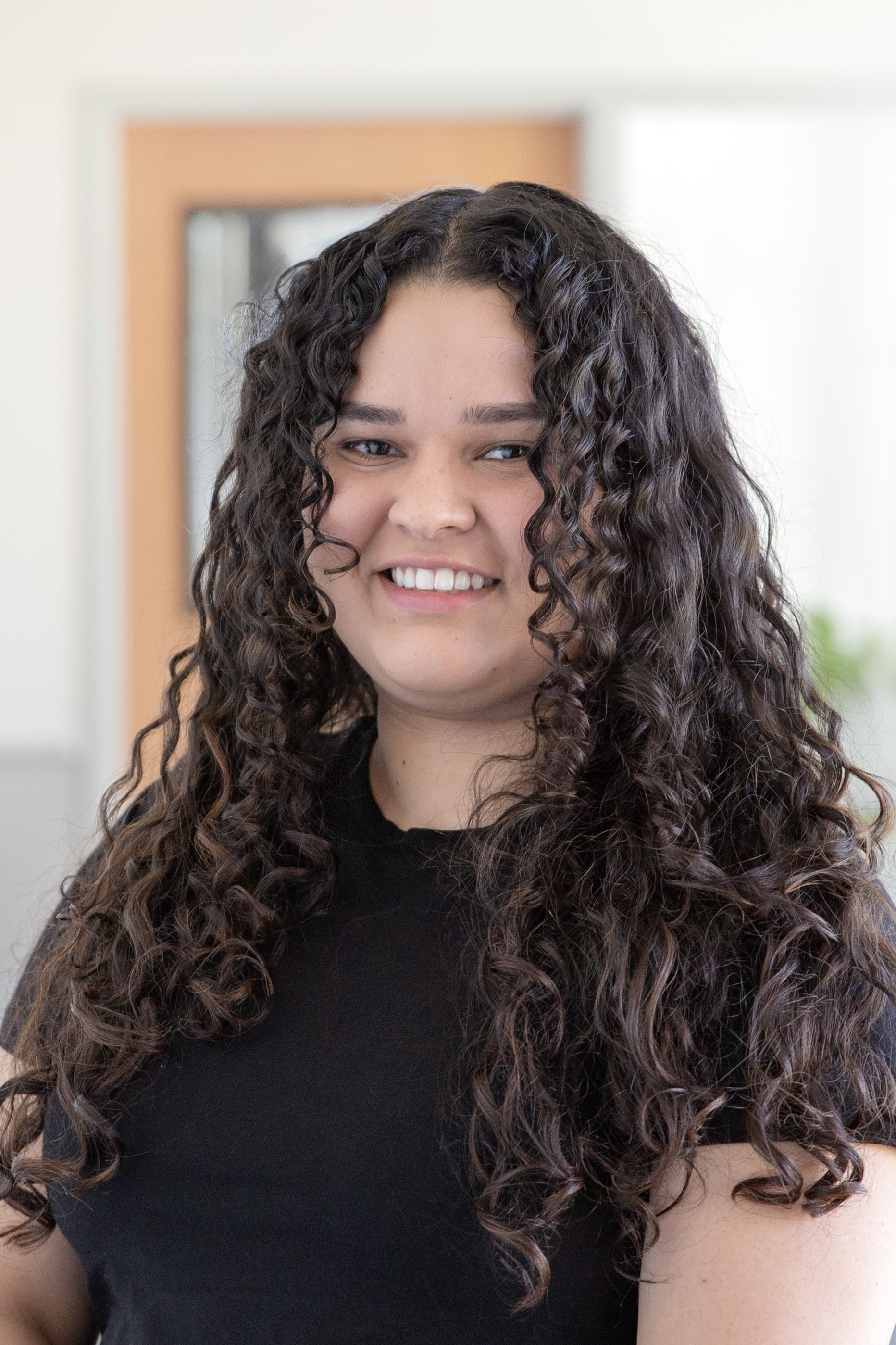 A person with curly hair.