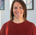 A woman smiling for the camera.