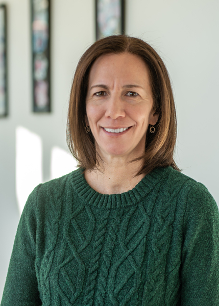 A woman smiling for the camera.