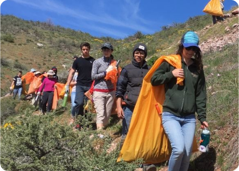 A group of people walking on a trail.