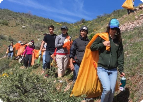 A group of people walking on a trail.