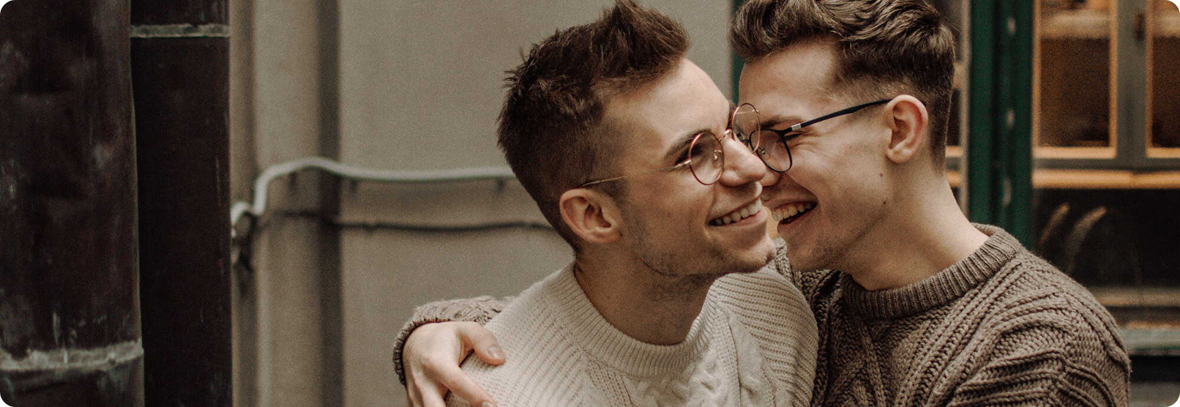 A man with his hand on another man's shoulder.