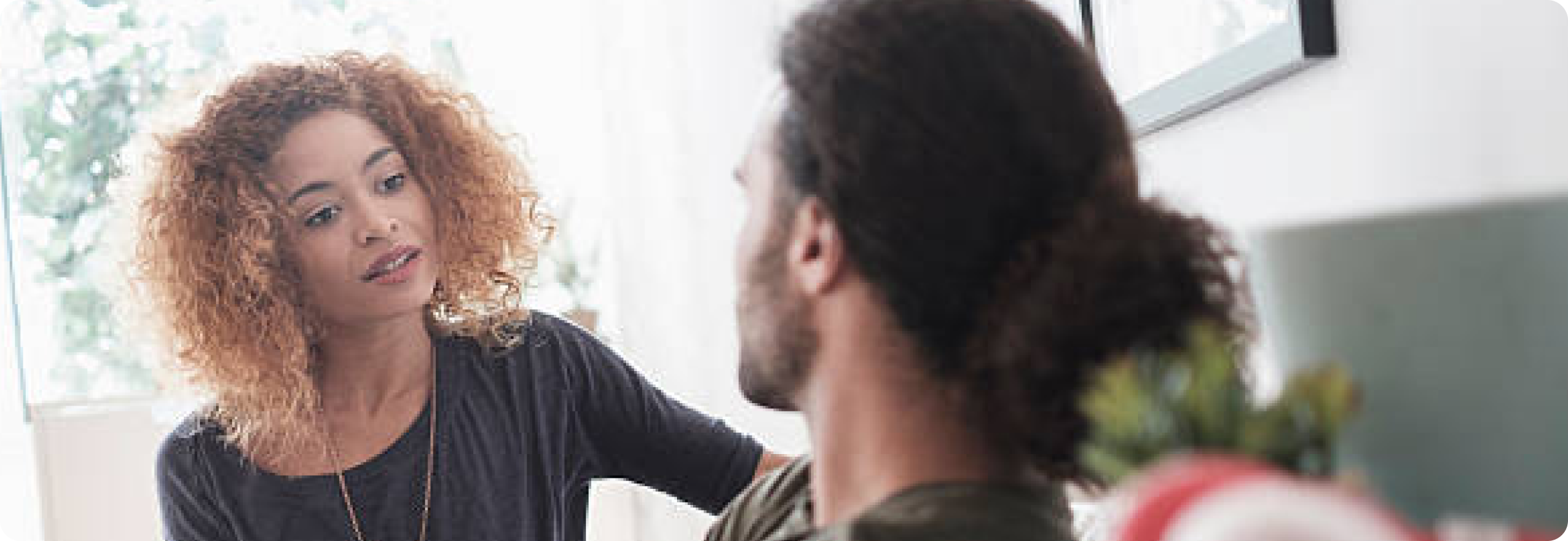 A woman looking at a man.