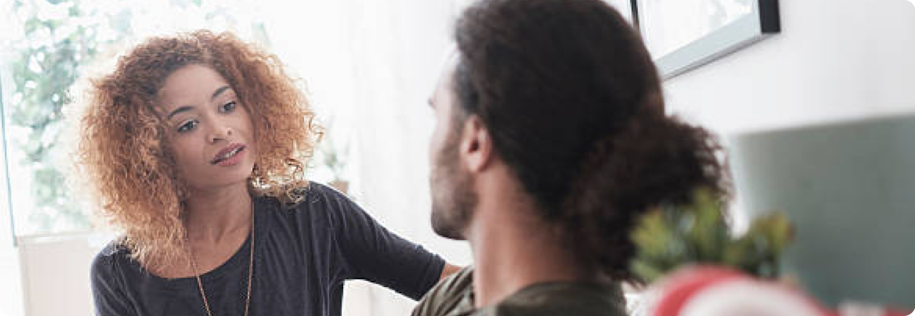 A woman looking at a man.