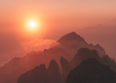 A sunset over a mountain range.