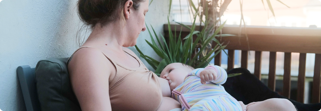 A woman holding a baby.