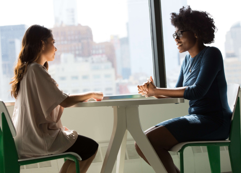 A woman and a man sitting at a table.