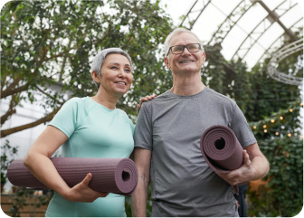 A man and woman holding a skateboard.