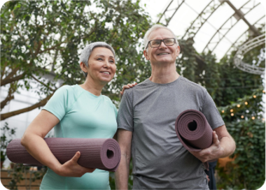 A man and woman holding a skateboard.