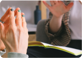 A person holding the hands up.