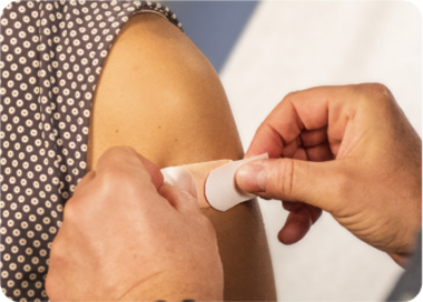 A person holding a bottle.