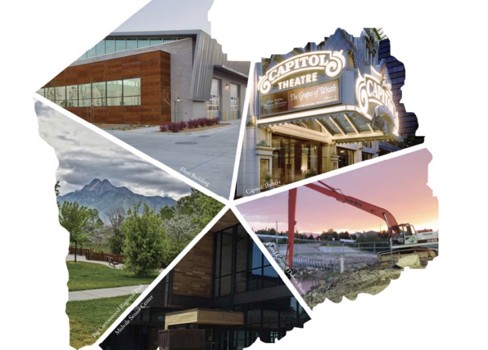 A building with a pool in front.