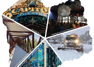 A building with a tower and a snow covered ground.