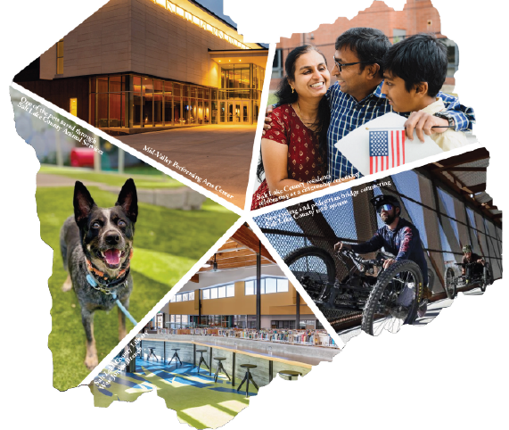 A group of people posing for a picture with a dog.