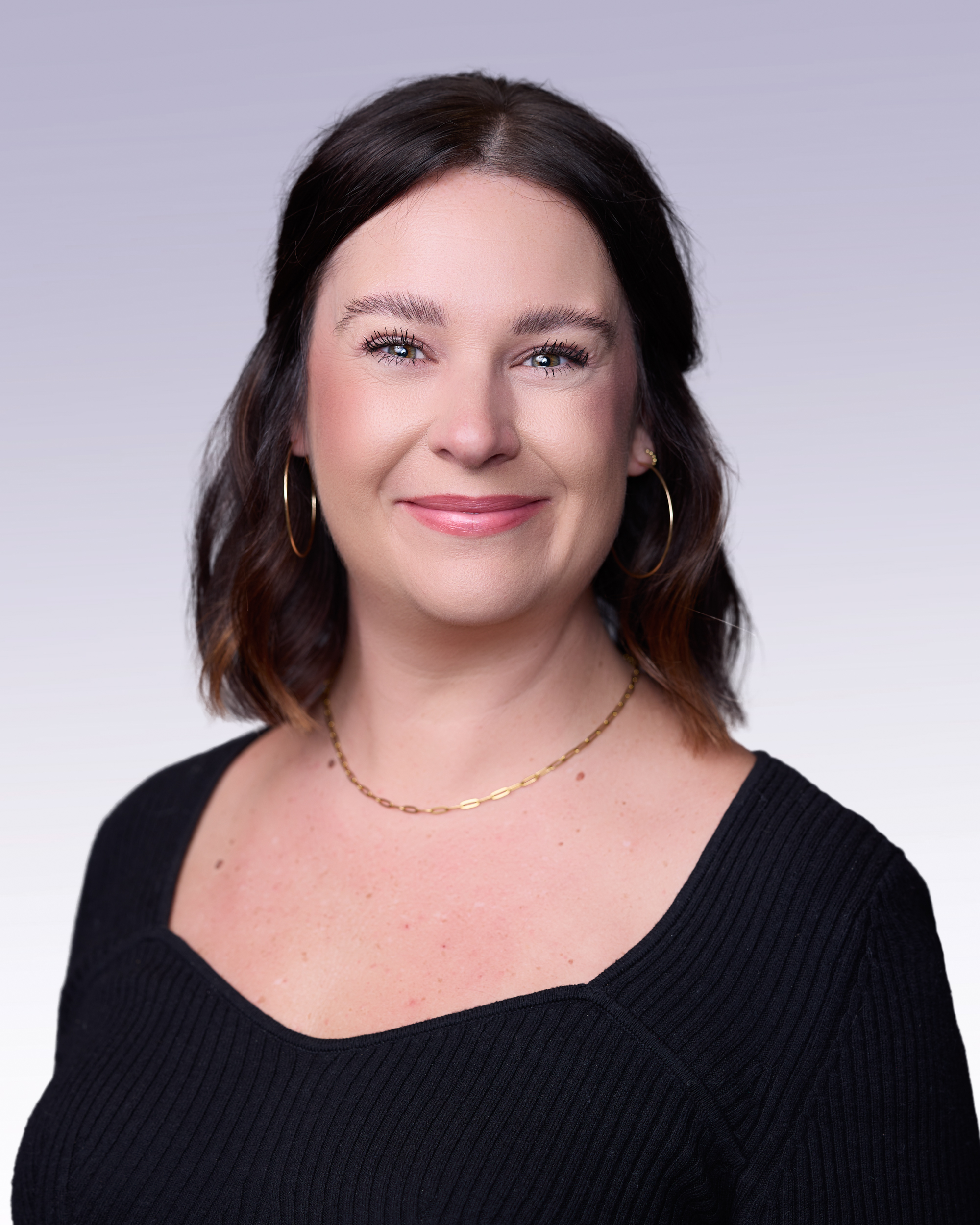 A woman wearing a black dress.