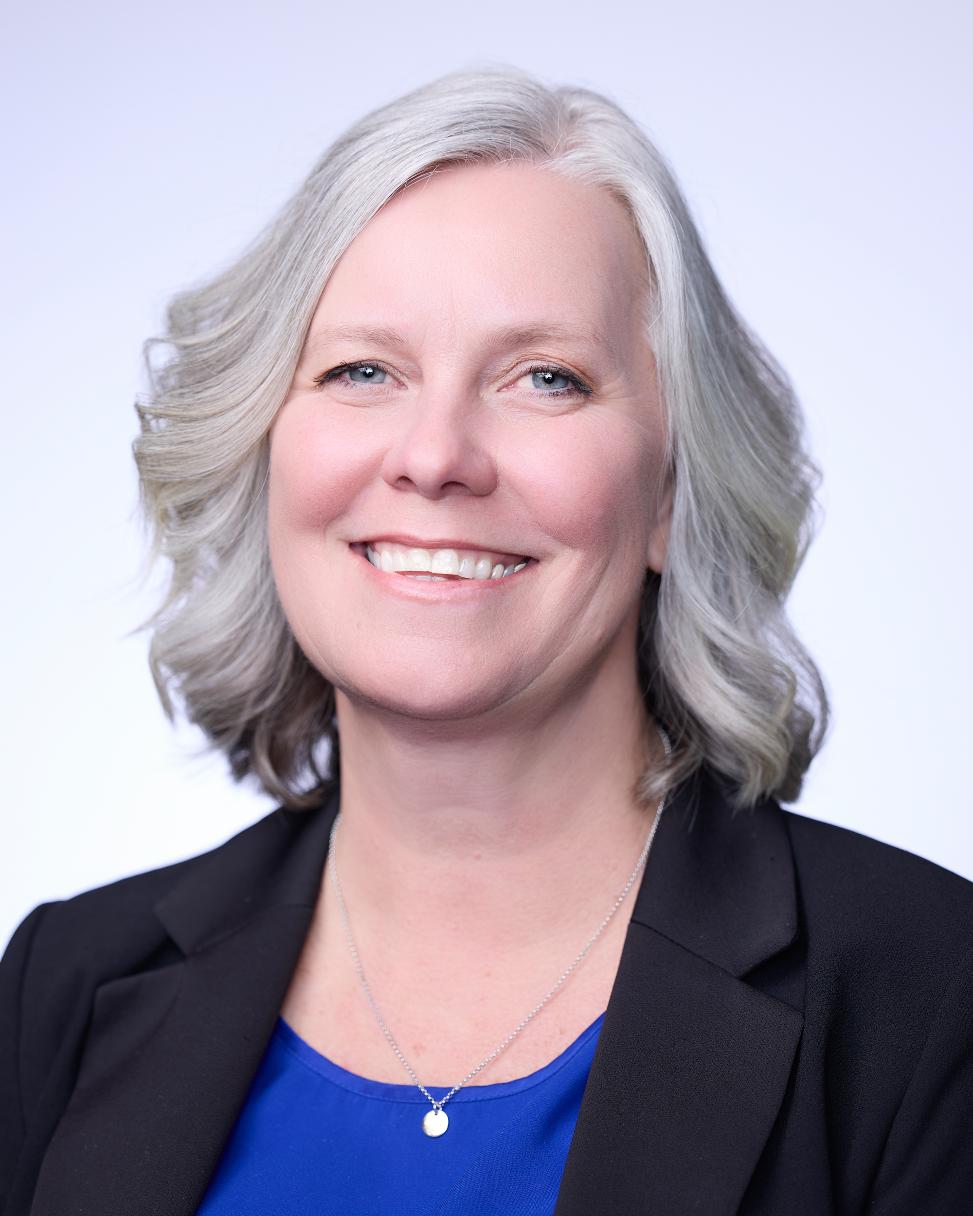 A close-up of a woman smiling.